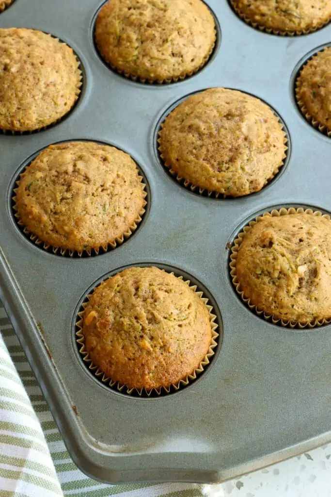 Enjoy these moist Zucchini Muffins made with fresh zucchini, ground cinnamon, and pecans for your on the go breakfast or next weekend brunch.