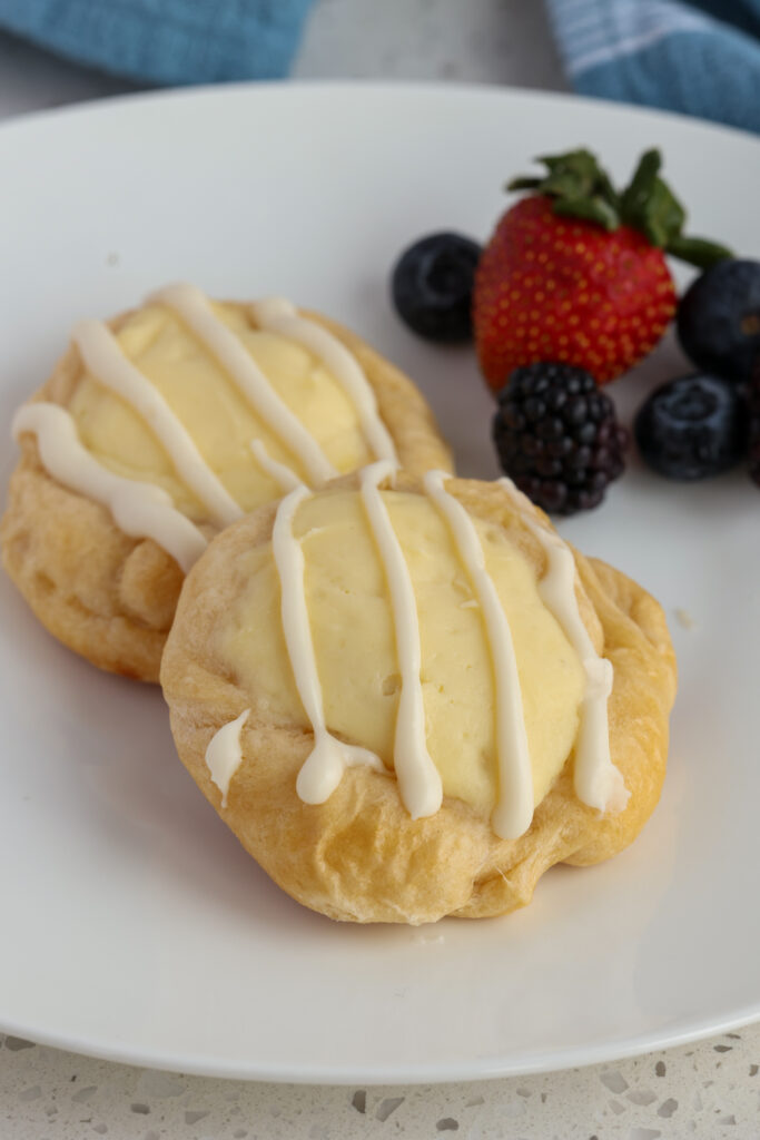 Cream Cheese Danish on a plate with berries. 