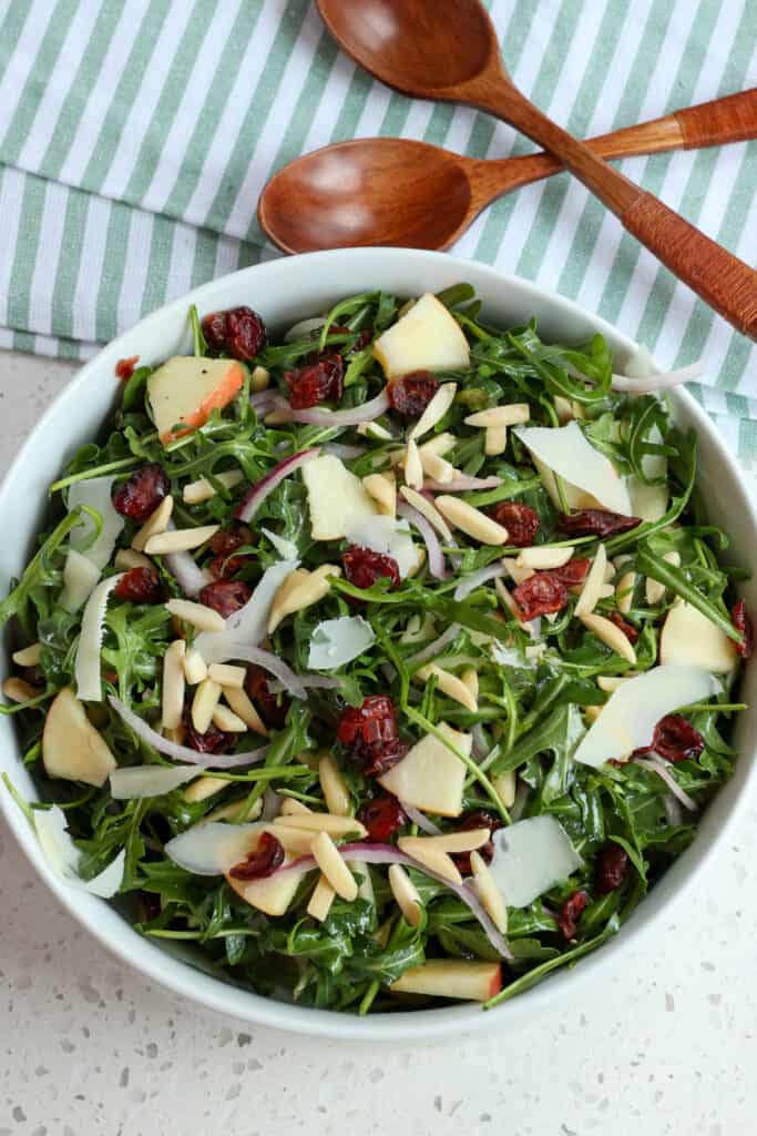 Arugula Salad with dried cranberries, almonds, red onions, and shaved Parmesan Cheese.