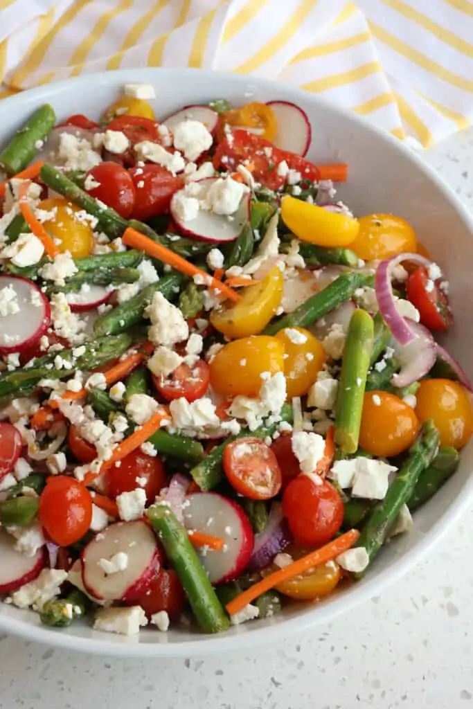 The asparagus salad is drizzled with lemon mustard vinaigrette. 