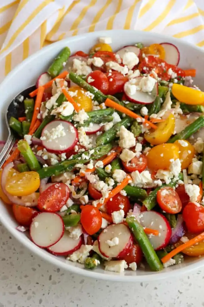 Top the asparagus salad with fresh thyme and crumbled feta. 