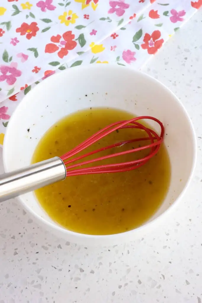 A small bowl of Lemon Honey Mustard Vinaigrette