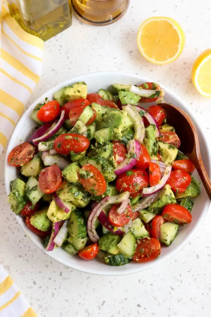 Fresh avocado salad with sun ripened tomatoes, sweet red onion, and crisp cucumber. 