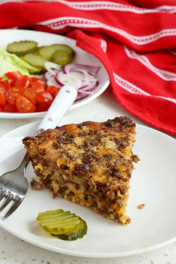 Delicious and easy Cheeseburger Pie made with ground beef, bacon, onions, cheddar, Pepper Jack Cheese, and Bisquick Baking Mix. 