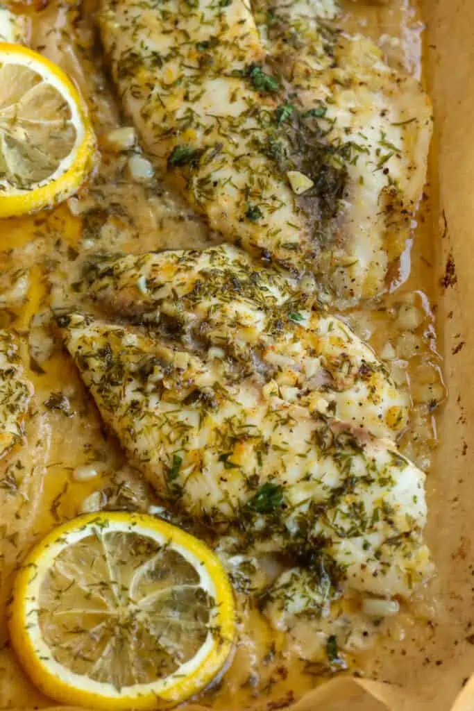 Baked Tilapia filets with lemon, dill, garlic, and parsley. 