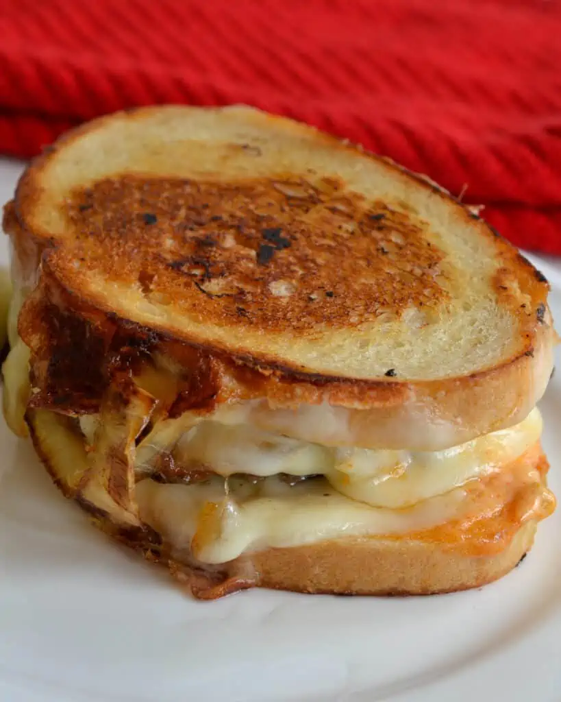Old style diner patty melt with caramelized onions and Swiss cheese.