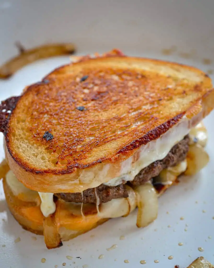This mouthwatering good Classic Patty Melt combines beef patties grilled to perfection with plenty of sweet melt-in-your-mouth caramelized onions, homemade thousand island dressing, and plenty of melted Swiss cheese. 