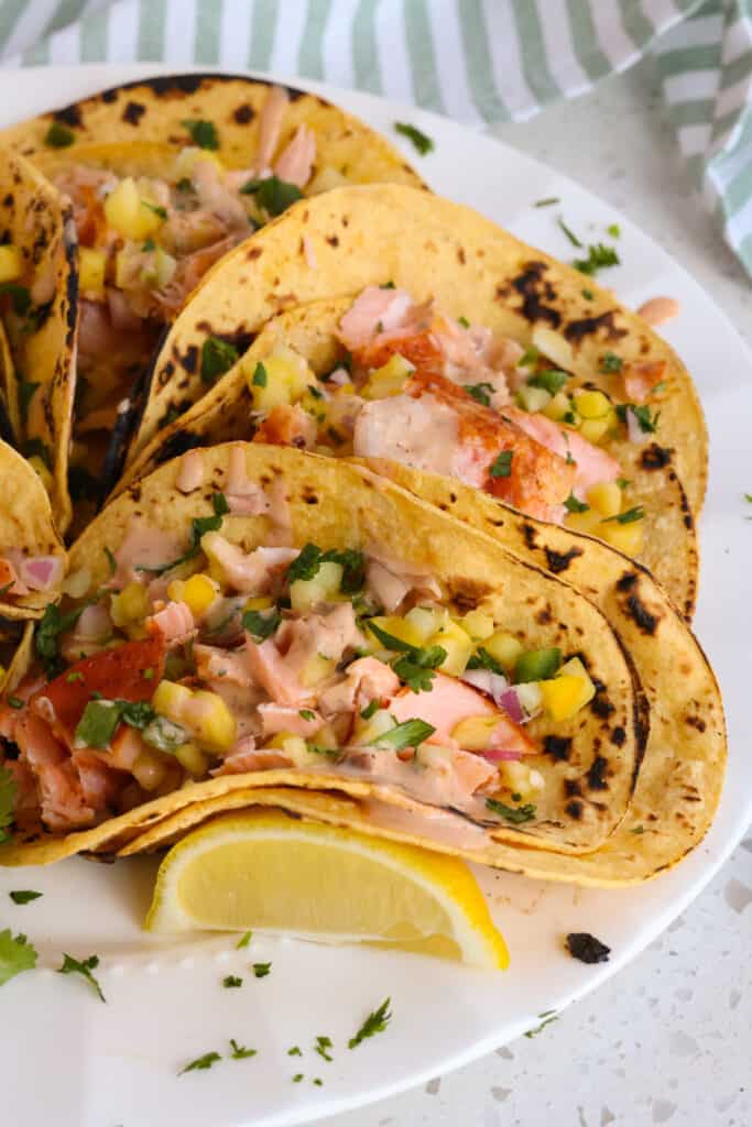 Garnish  the tacos with lemons or limes and chopped fresh chopped cilantro.  