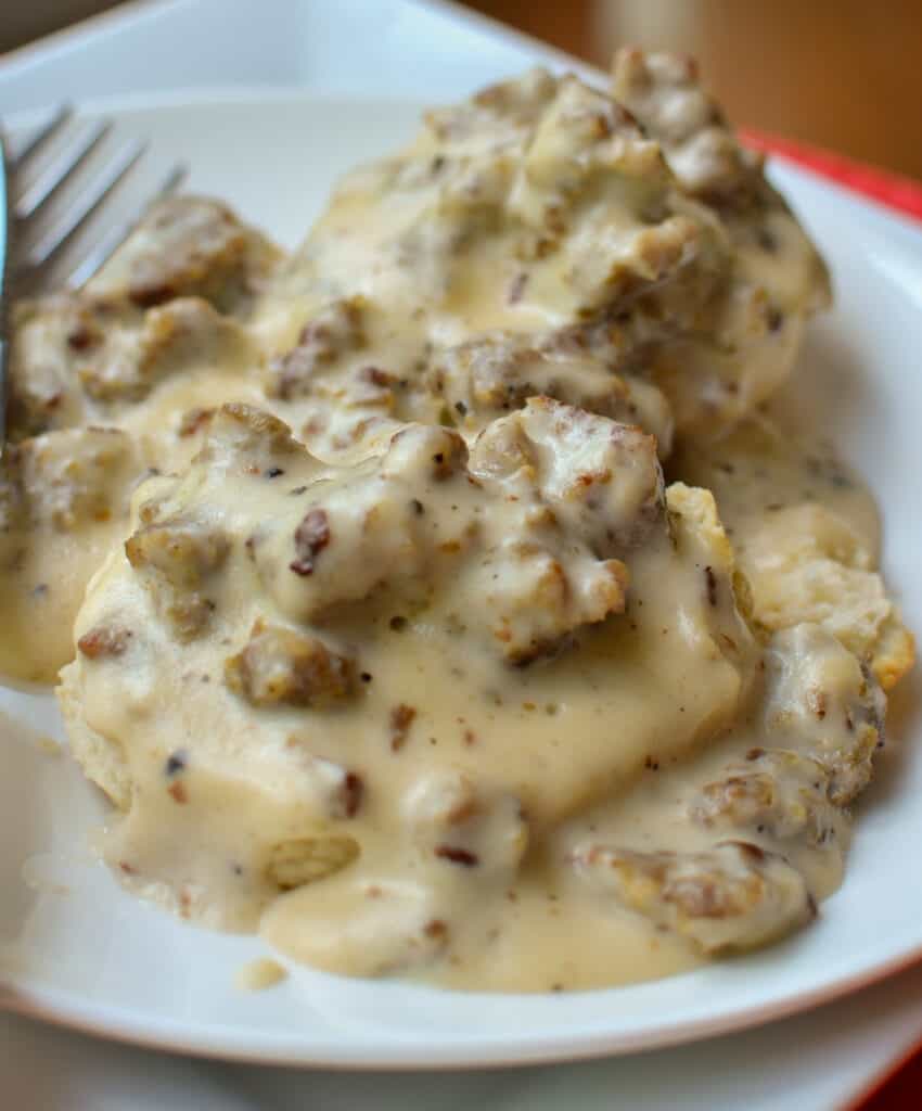 Easy Homemade Biscuits and Gravy A plate full of homemade biscuits and gravy.