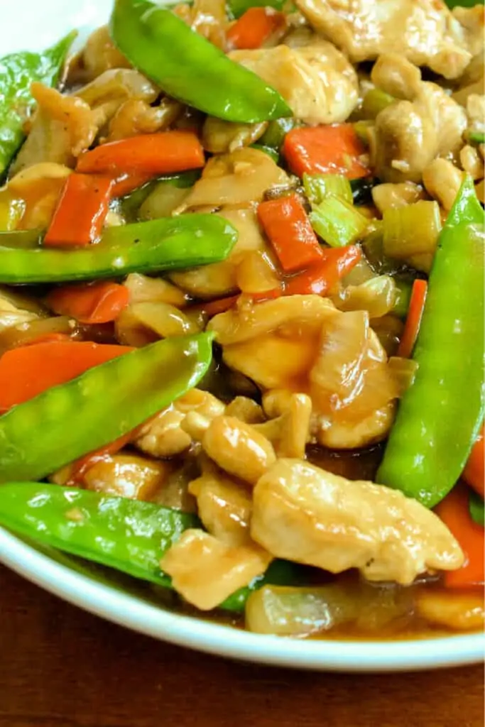 A simple yet delicious stir fry Chicken Chop Suey Recipe with tender chicken bites, snow peas, onions, carrots and mushrooms all in an easy to make flavorful gravy.