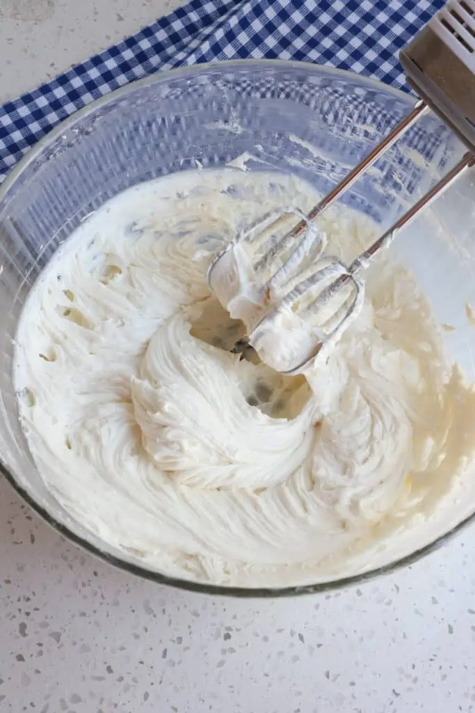Using a stand mixer or hand mixer on high beat the cream cheese and butter until they are smooth and creamy with no lumps. 