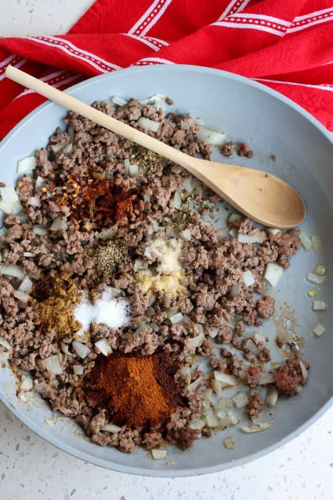 Combine the browned ground beef with the seasonings.  
