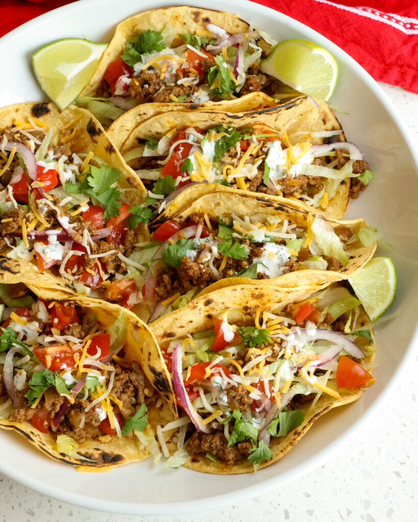 Ground beef tacos in corn tortillas. 