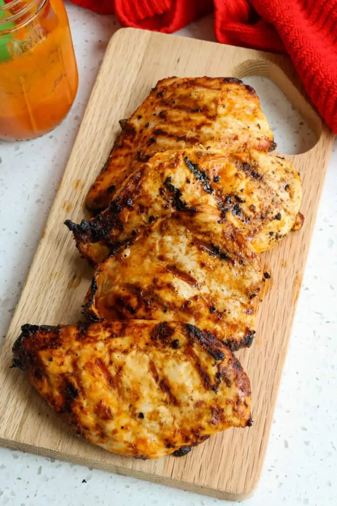 This tasty Buffalo Chicken Breasts Recipe is chicken breasts marinated in buffalo sauce and grilled to perfection, making them flavorful, juicy, and tender, just like buffalo chicken wings with just the right amount of spice.