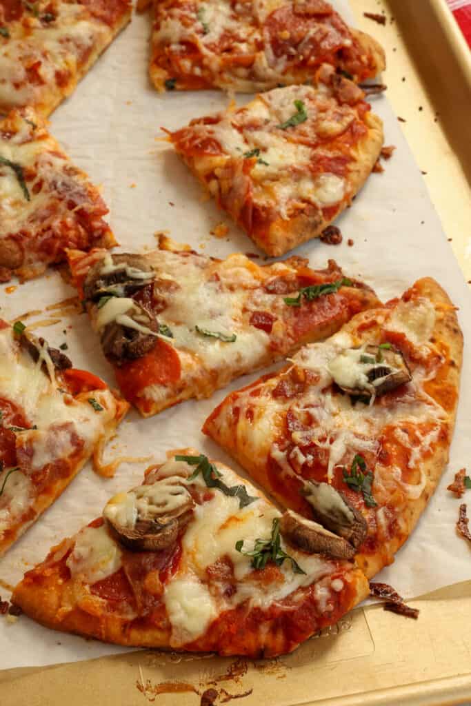 Slices of naan pizza fresh out of the oven.