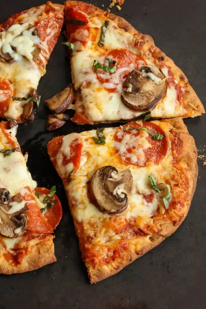 Pepperoni, mushroom and cheese naan pizza. 
