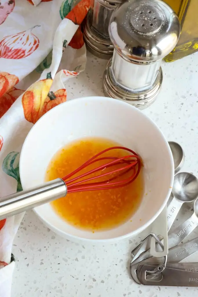 Mix all the ingredients for the vinaigrette with a whisk in a small bowl. 