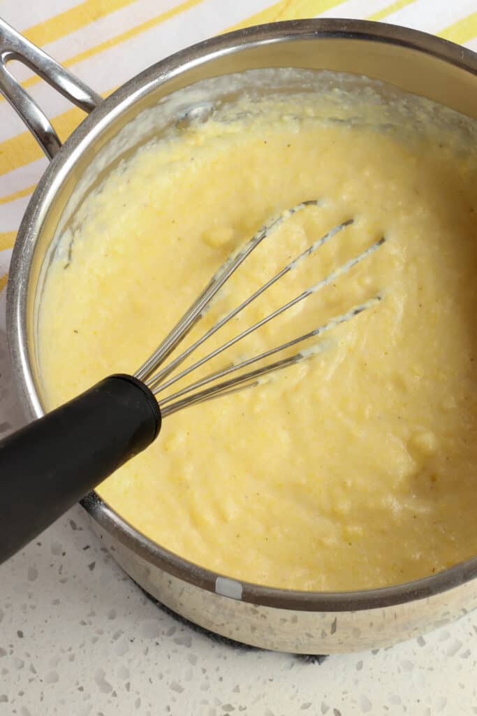 Mix the hot milk and cornmeal together. 