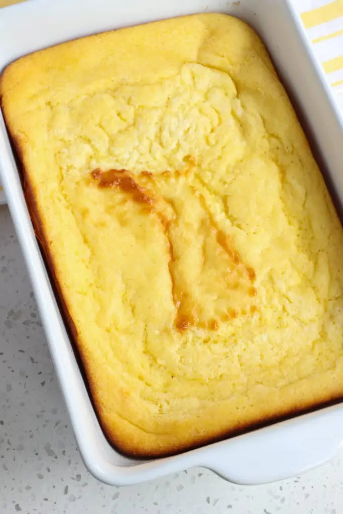 A casserole dish full of classic homemade spoon bread. 