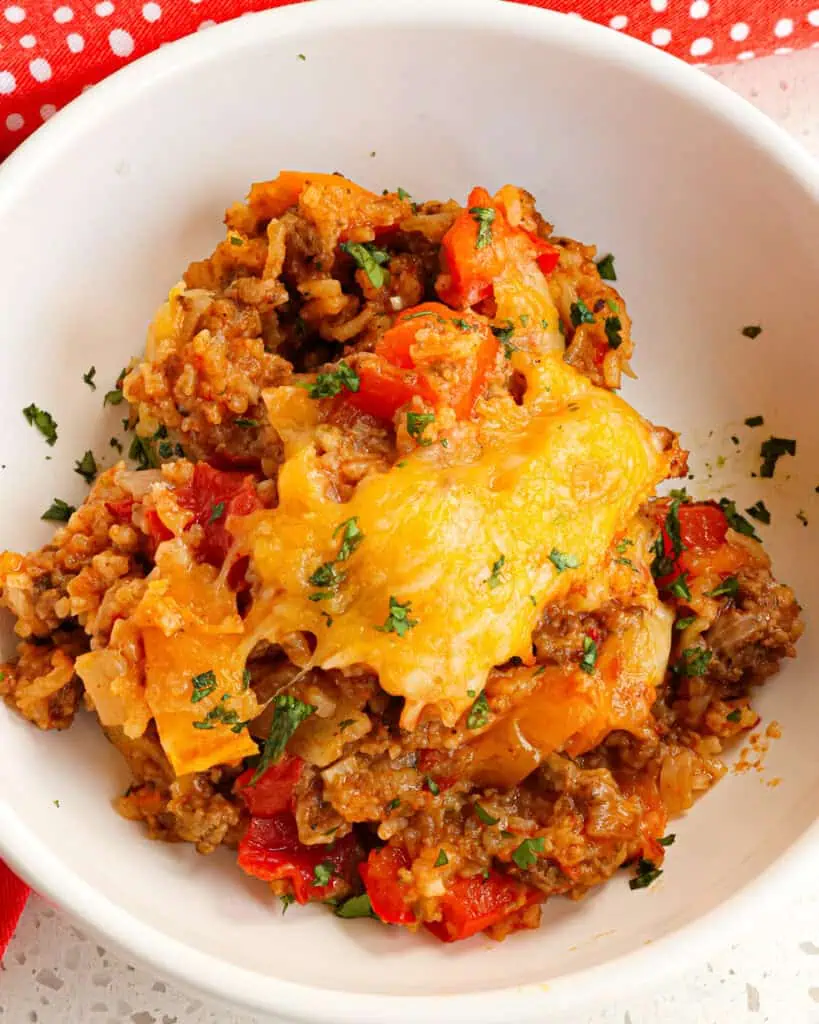 A close up view of a single serving bowl full of stuffed pepper casserole.