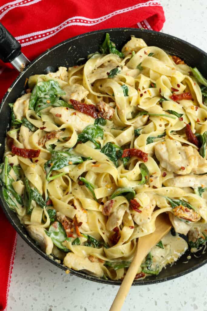 Creamy Tuscan Chicken Pasta with golden brown chicken, baby spinach, and sundried tomatoes in a luscious garlic Parmesan cream sauce. 