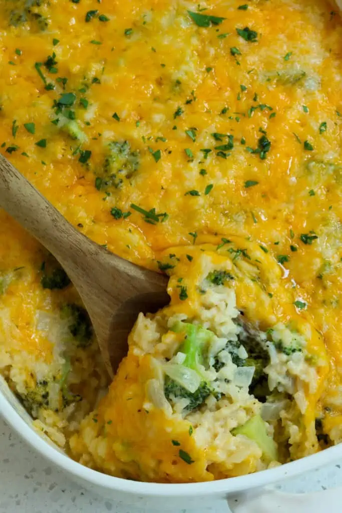 A cheesy Broccoli Rice Casserole with a made from scratch creamy cheddar cheese sauce, fresh broccoli, onions, and garlic. 