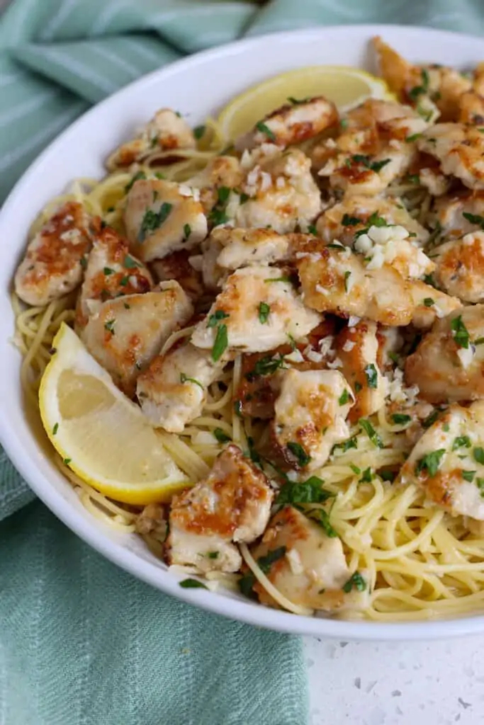 Quick and easy Chicken Scampi is lightly breaded chicken pieces cooked to golden brown perfection and combined with pasta in a lemon garlic butter sauce with freshly grated Parmesan.