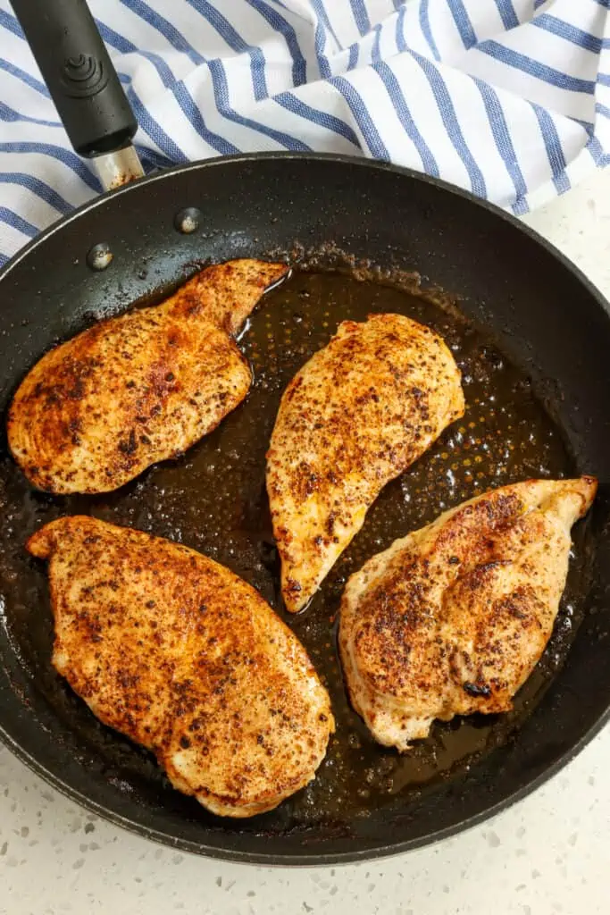 Then add a little butter and olive oil to a large skillet over medium heat.  Add the chicken and cook until golden brown on both sides.  