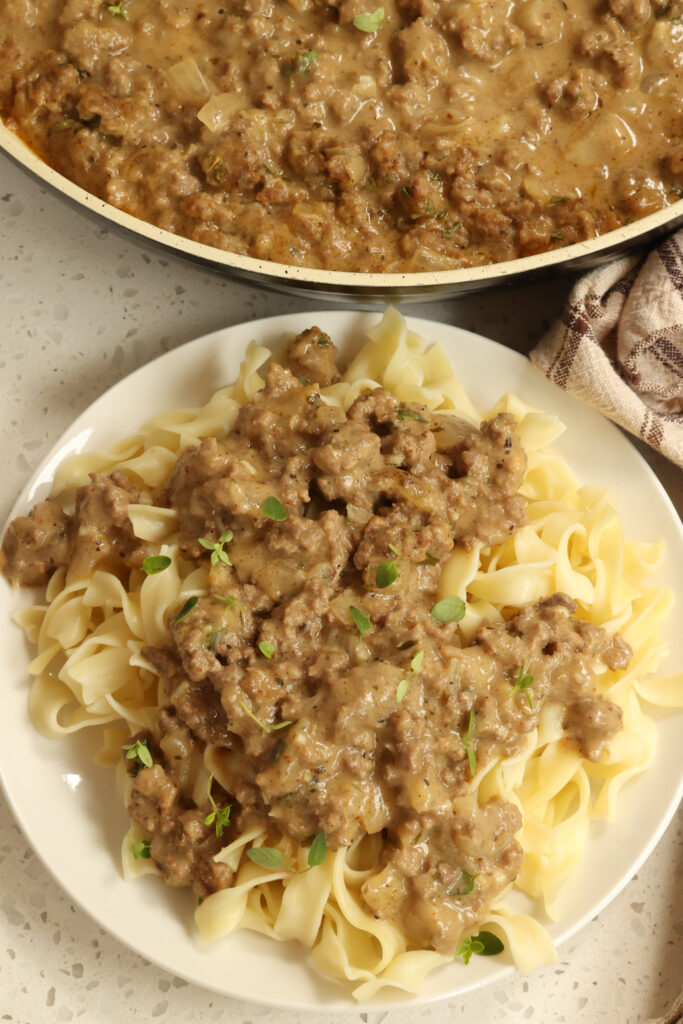 A quick and easy creamy Hamburger Gravy that is delicious over mashed potatoes, egg noodles, pasta, rice, and buttermilk biscuits.  