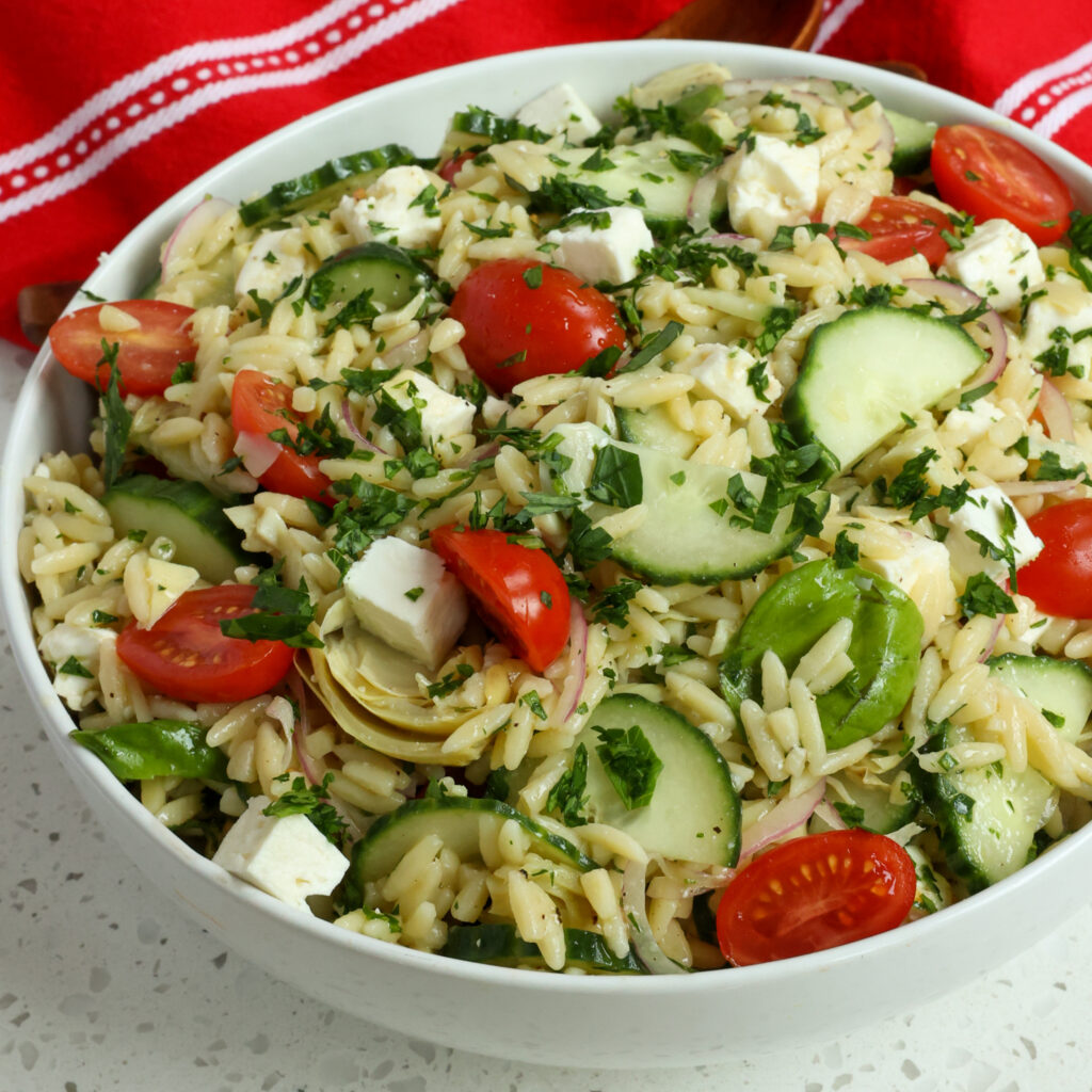 https://www.smalltownwoman.com/wp-content/uploads/2022/05/Orzo-Pasta-Salad-Facebook-1024x1024.jpg