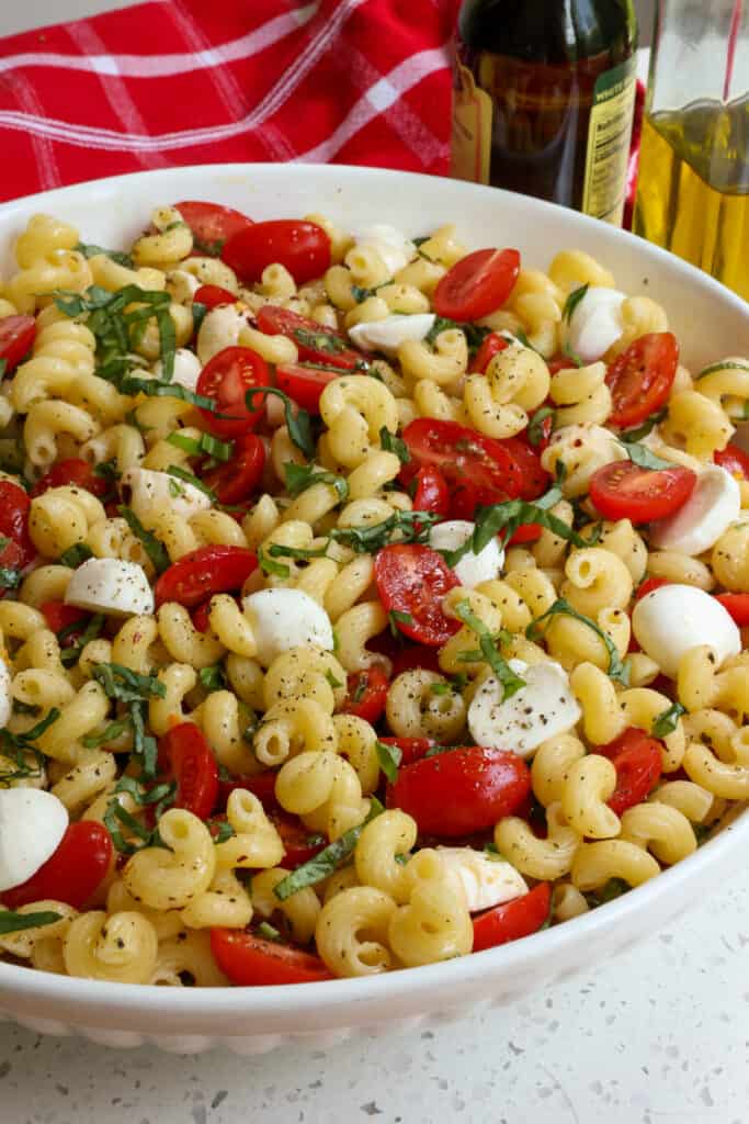 This Caprese Pasta Salad combines pasta, sun-ripened tomatoes, fresh mozzarella, and garden fresh basil all drizzled with an easy four ingredient balsamic vinaigrette. 