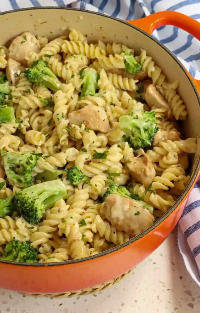 A delicious and easy Chicken Broccoli Alfredo with golden brown chicken bites, crisp tender broccoli, rotini pasta, and homemade alfredo sauce.