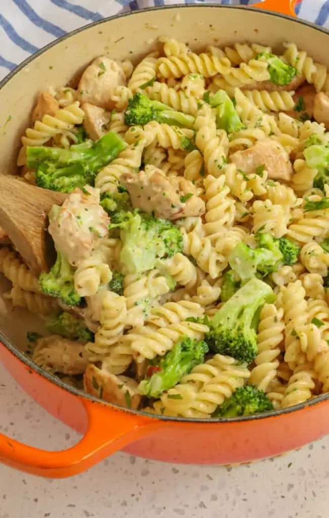 Add the drained pasta, broccoli, and chicken to the pot with the alfredo sauce and stir to coat.  Garnish with shredded fresh Parmesan Cheese and chopped fresh parsley. 