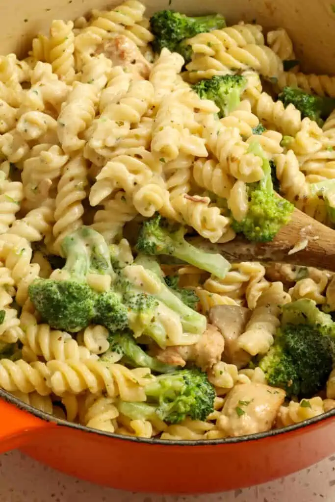 Delicious and easy Chicken Broccoli Alfredo combines rotini pasta, golden brown chicken pieces, and broccoli in a creamy homemade alfredo sauce.