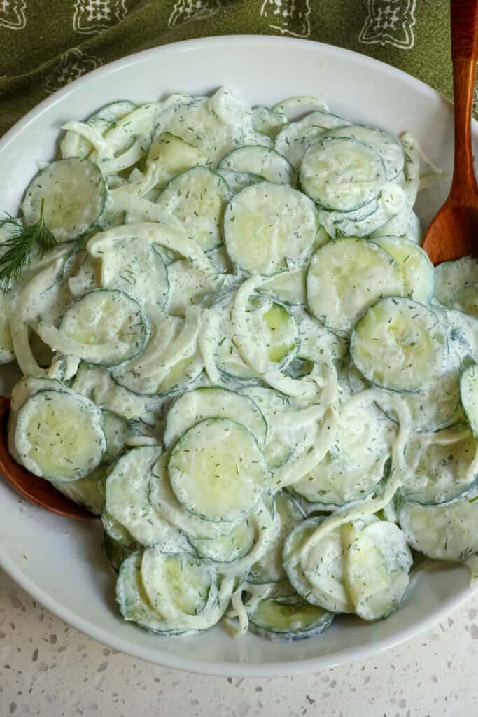 This delectable sour cream based German Cucumber Salad also known as gurkensalat is made with a little more than a handful of ingredients in less than fifteen minutes. 
