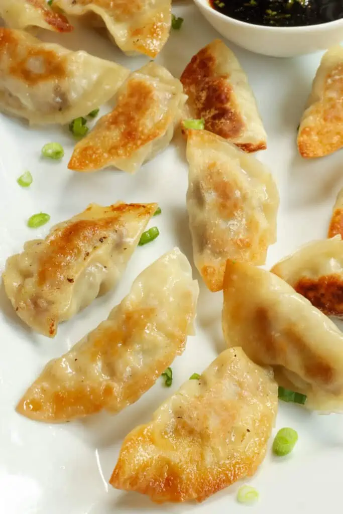 This Gyoza recipe is Japanese dumplings stuffed with cabbage, ground pork, garlic, ginger, and green onions all pan fried and steamed to perfection.
