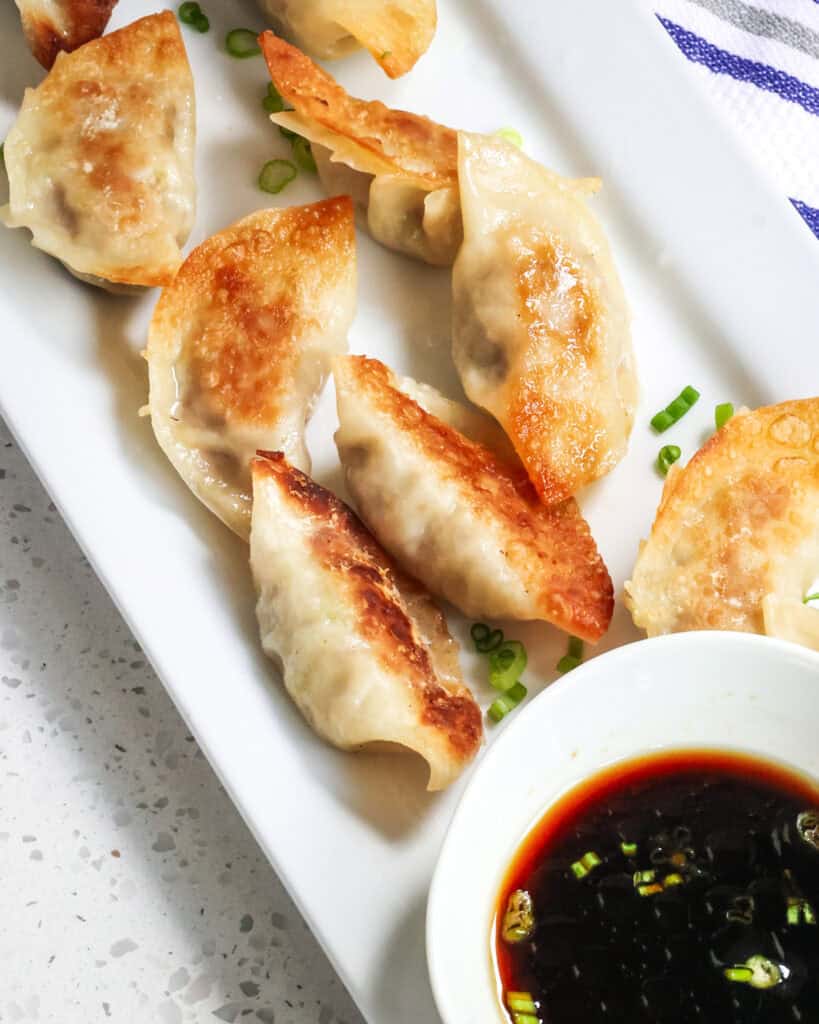 This Gyoza recipe is Japanese dumplings stuffed with cabbage, ground pork, garlic, ginger, and green onions all pan fried and steamed to perfection.