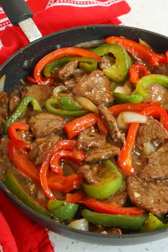This beautiful One Skillet Steak and Peppers has so much flavor. It is packed full of juicy steak, tender crisp onions and bell peppers in a lightly sweet and savory ginger beef sauce. 