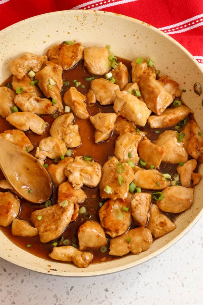 Add the cooked chicken back to the skillet and sprinkle with chopped green onions.  
