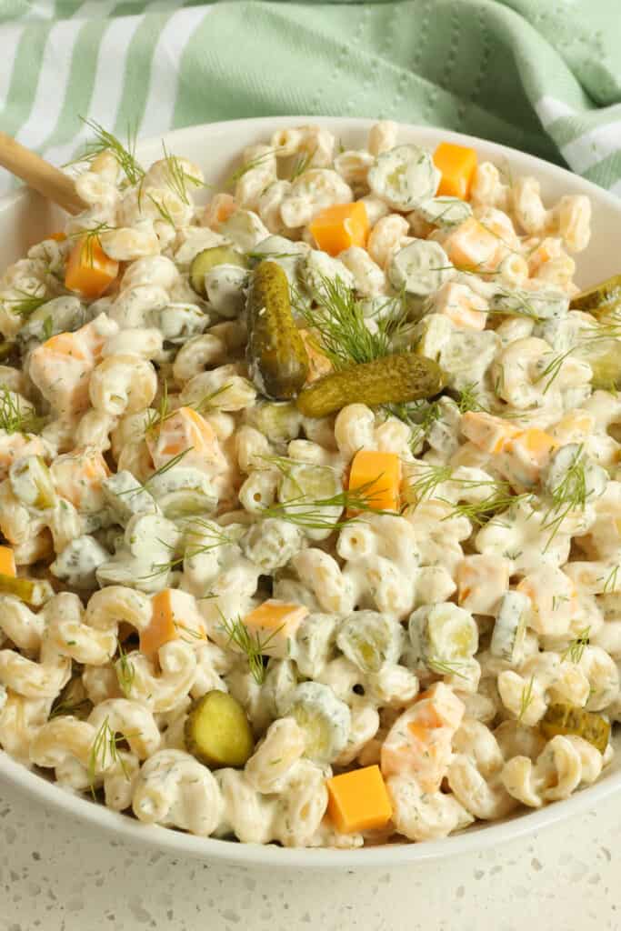 Dill pickle fans unite with this tasty and easy Dill Pickle Pasta Salad with an easy five ingredient dressing, dill pickles, cheddar cheese, and fresh dill.
