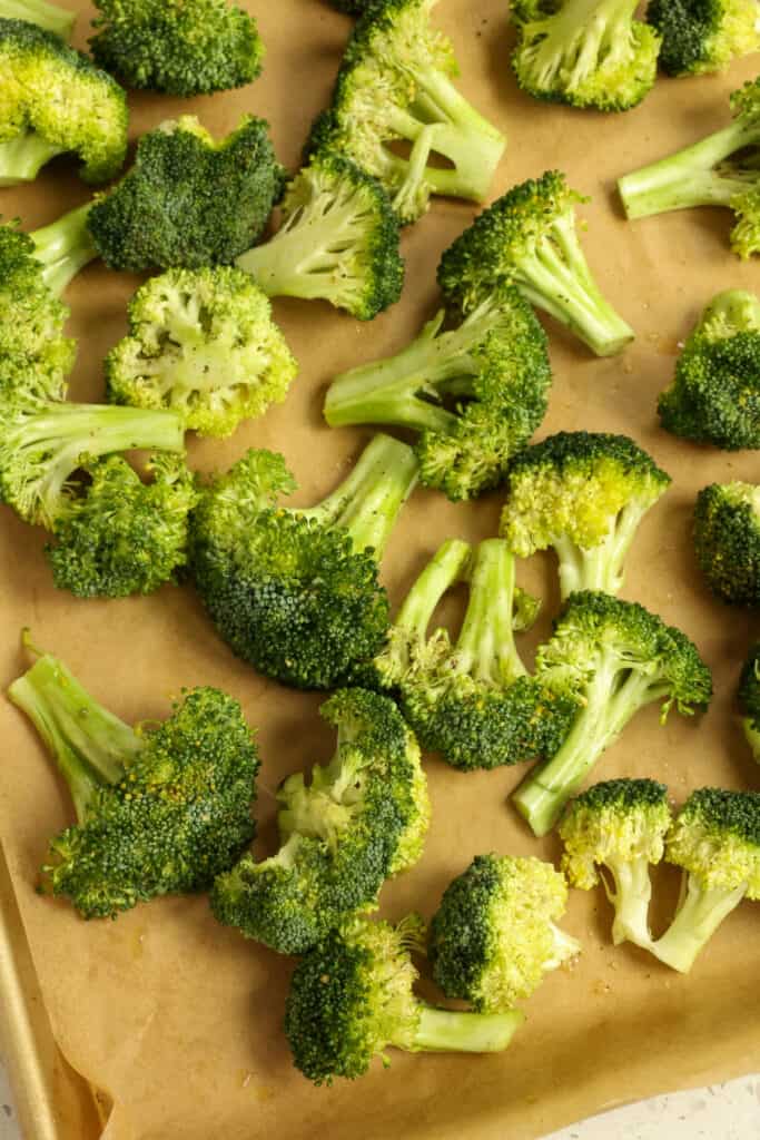   Now spread the broccoli out in a single layer on a parchment paper covered sheet pan.