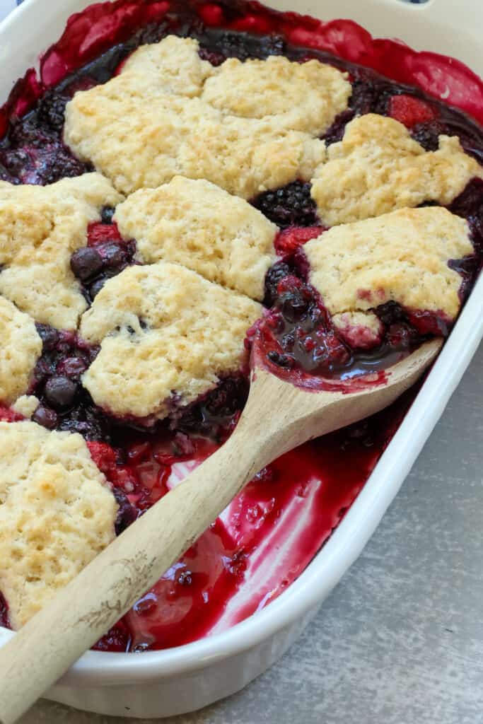 This quick and easy mixed Berry Cobbler with a flaky buttery biscuit like topping is prepped and in the oven in less than 15 minutes.