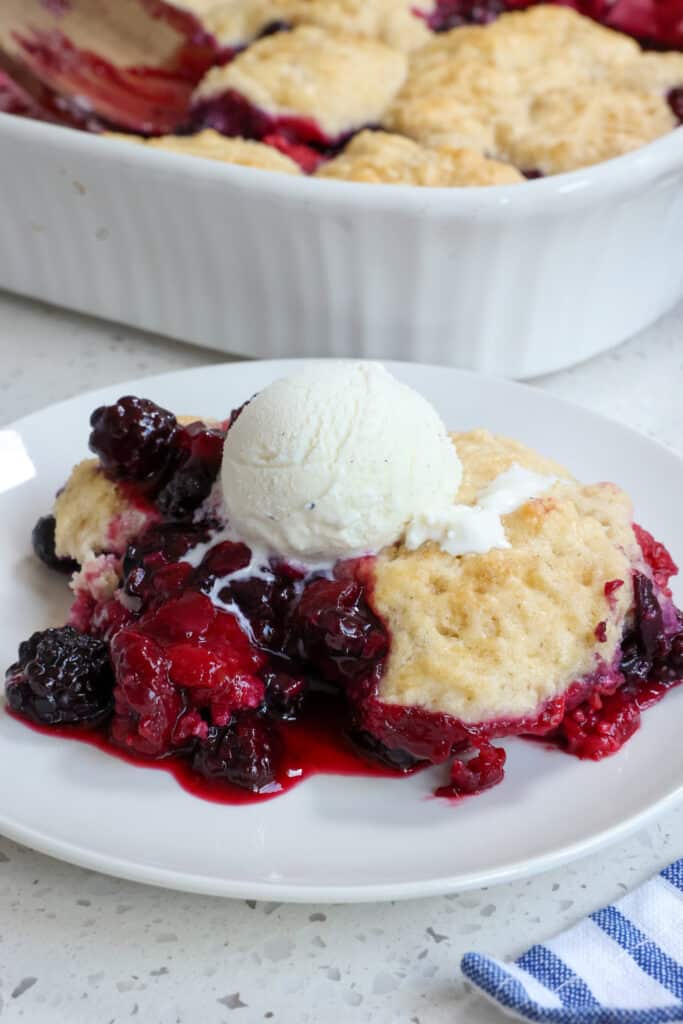 Serve the cobbler with a scoop of vanilla ice cream or fresh whipped cream.   