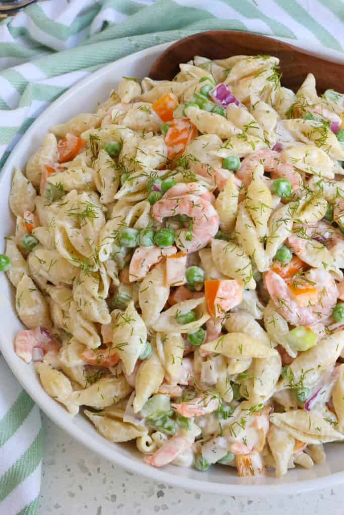 A quick and easy cold Shrimp Pasta salad with peas, bell pepper, and red onion all in a lightly sweetened garlic mustard mayonnaise based dressing.  
