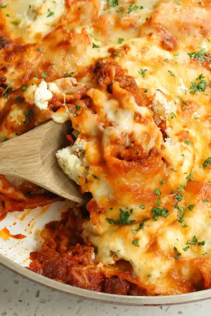 This one skillet lasagna combines Italian sausage, onion, garlic, and lasagna noodles all cooked up in marinara sauce and topped with ricotta cheese and mozzarella cheese.