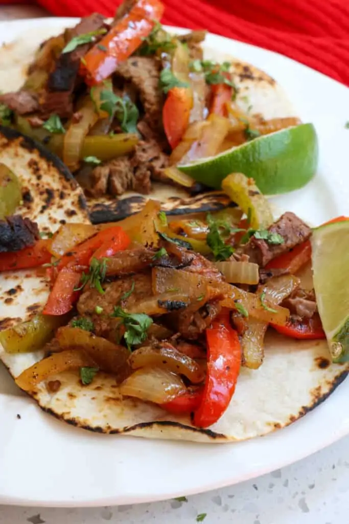Make better than Mexican Restaurant quality Steak Fajitas bursting with fresh flavor from lime juice, garlic, chili powder, cumin, paprika, and cayenne. 