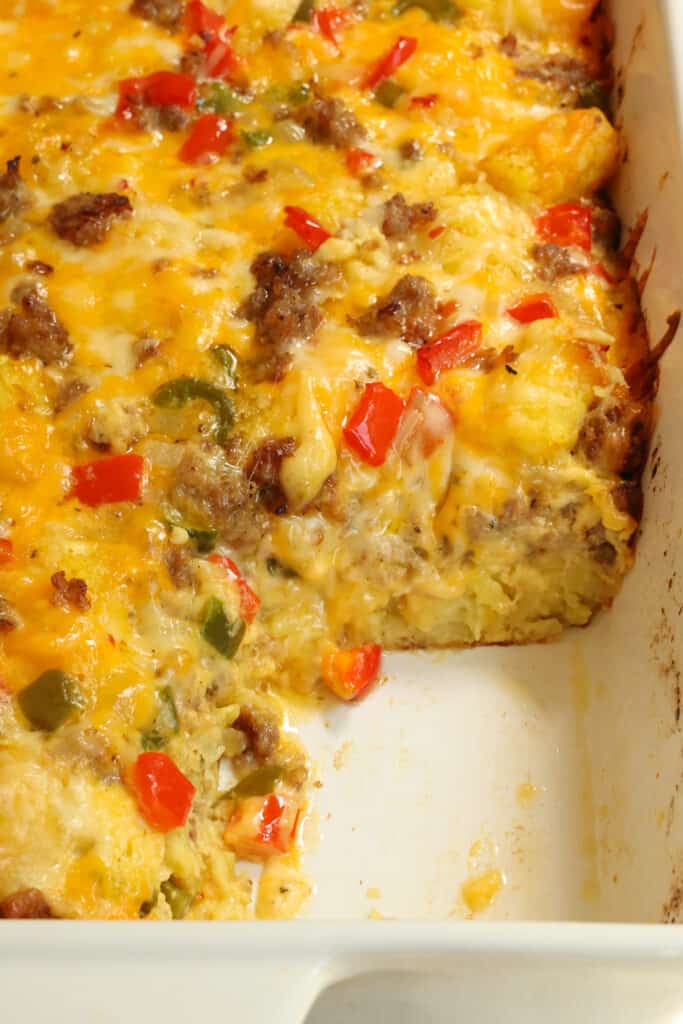 Delicious Tater Tot Casserole with eggs, sausage, cheddar cheese, and Monterey Jack Cheese. 
