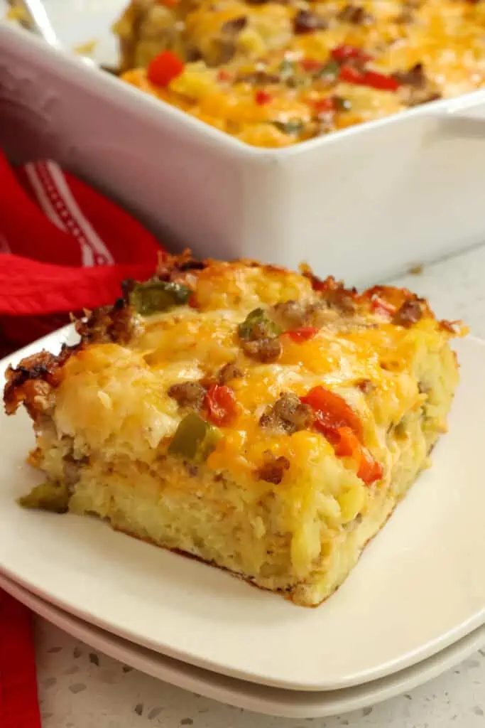 Enjoy this tasty make ahead Tater Tot Breakfast Casserole with plenty of eggs and pork sausage blanketed in layers of cheddar cheese and Monterey Jack Cheese.