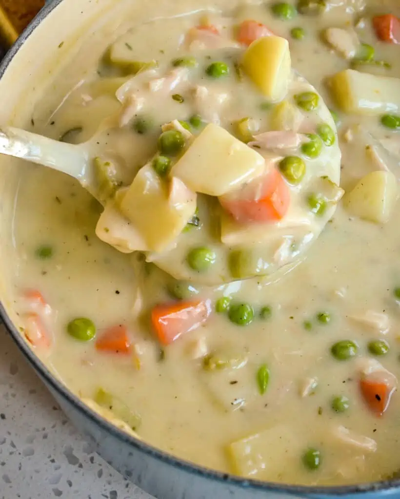 Chicken Pot Pie Soup has all the comforts of the traditional pot pie without the time and hassle of rolling a fresh baked crust. This is comfort food at its best topped with fresh biscuits. 