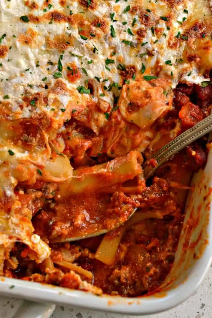 This amazing Baked Ziti recipe is layered with Italian sausage, ricotta cheese, sweet marinara sauce and plenty of mozzarella.